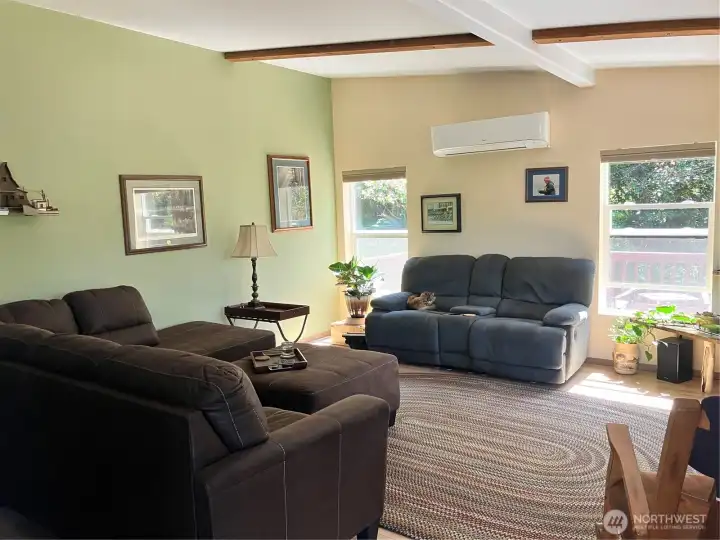 Open front door and your greeted with a large living room