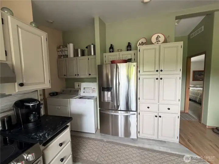 at the kitchen window looking back at pantry