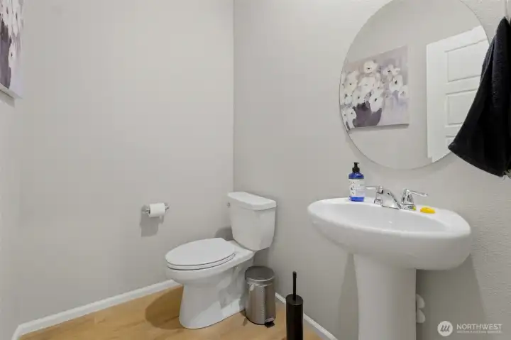 Main floor half bath, just off the garage.