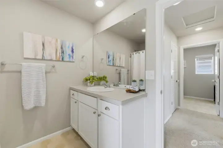 Upstairs bath is close to the conveniently located upstairs laundry room!