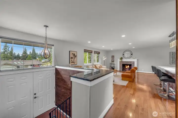 Grand double doors open to a bright, welcoming foyer.