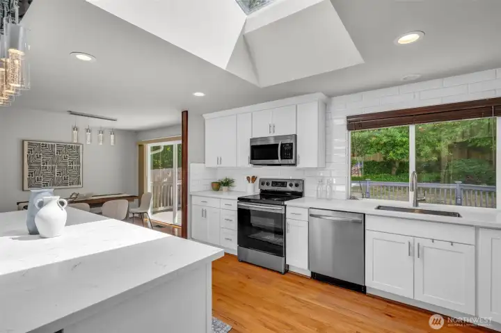 Stylish kitchen design highlighting beautiful hardwood flooring and ample workspace