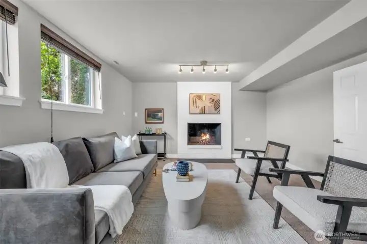 Warm and inviting family room anchored by a cozy brick fireplace