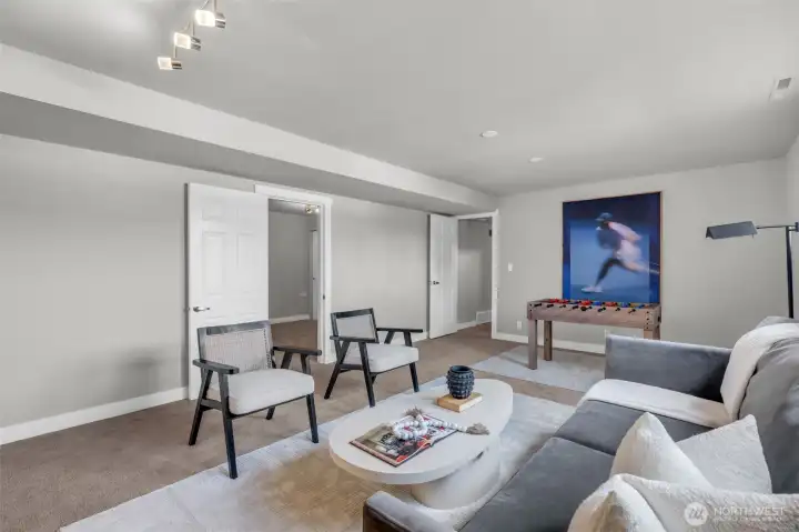 Versatile lower-level family room with plenty of space for both relaxation and entertainment