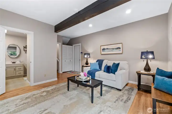 Bonus room on lower level with stunning exposed beam and recessed lighting Bonus room on lower level with stunning exposed beam and recessed lighting