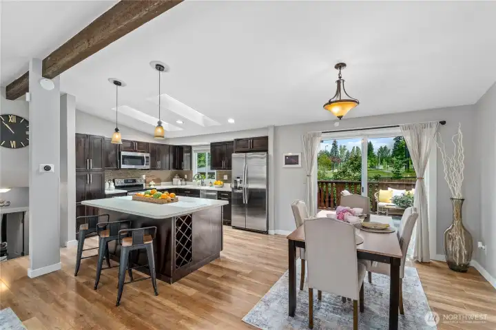 Open concept kitchen, dining and living spaces Open concept kitchen, dining and living spaces
