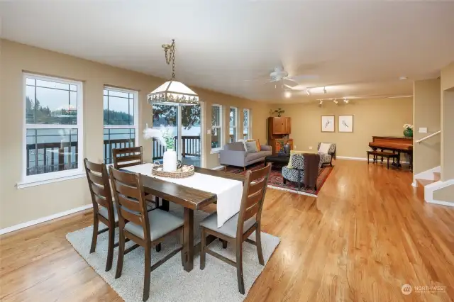 Open floor plan with kitchen, dining area and living room connected with easy access to upstairs area.