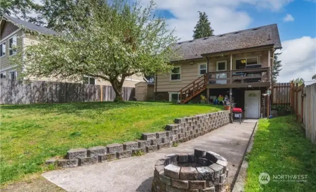 Large back yard and access to lower unit. Photo before new roof.