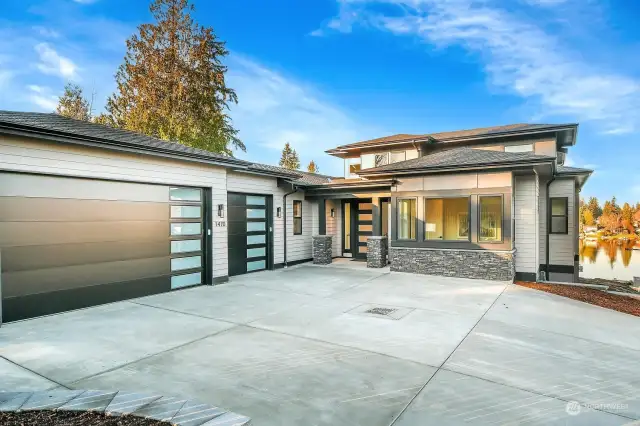 New Modern Home with 3 Car Garage, EV Charging and Room For Plenty of Guests to Park.