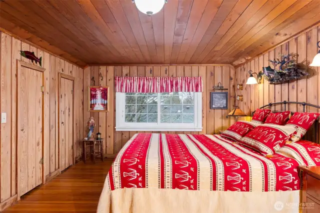 Upstairs bedroom with three built cedar closets
