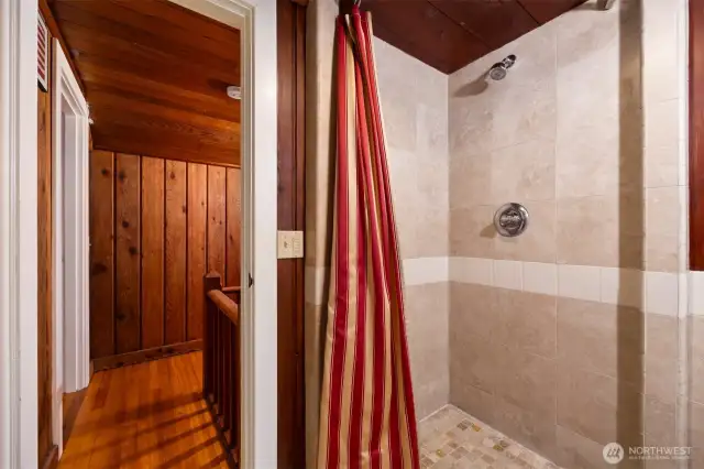 Tiled shower in upstairs bathroom