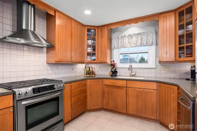 Updated kitchen with wood cabinetry and gas range
