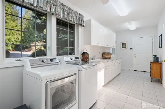 An oversized utility room connected to the three car garage and half bathroom.