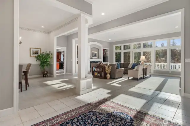 Soaring ceilings with crown molding, large bay of windows fills the space with natrual light.