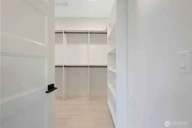 primary closet with full shelving