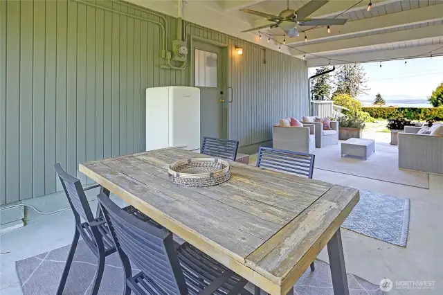 A covered breeze way for simple gatherings, coffee...and sunsets too. This home lives beautifully!