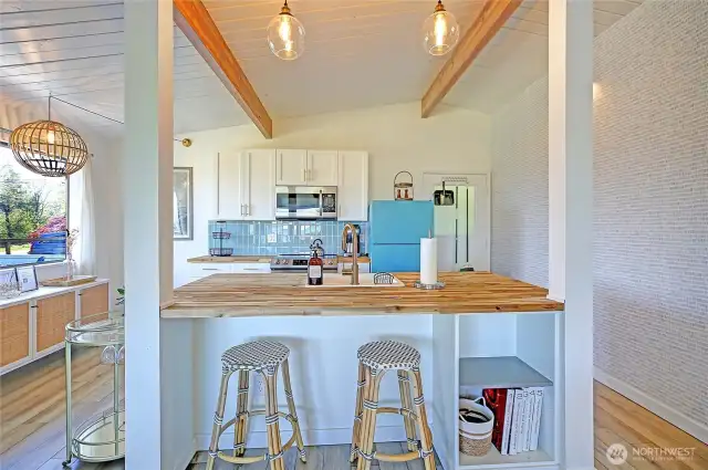 BRAND new and PERFECT is the open kitchen w/island + counter seating. Designer lighting, cabs, counters and...custom tile accents. You will adore this happy....Chef's kitchen!
