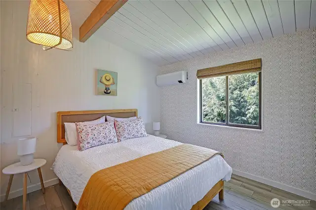 One of the 2 abundant in size bedrooms w/vaulted ceilings, new flooring, lighting and new AC/heat...energy efficient splits.