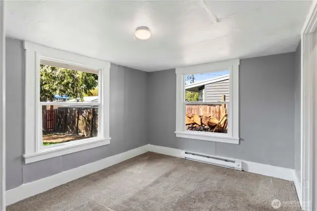 The guest bedroom has a closet and adjoins the bonus room