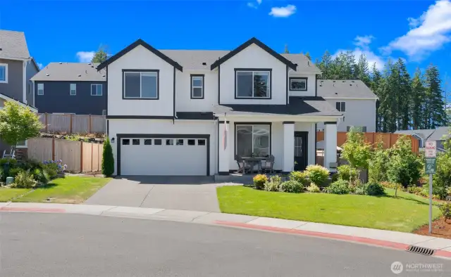 Tucked at the end of a peaceful cul-de-sac, this striking black-and-white residence captivates with timeless style, vibrant landscaping, and like-new move-in condition.