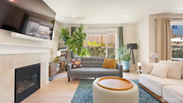 It's hard to think about now, but that gas fireplace will be so cozy in the winter! Today, you get to enjoy A/C, easy-care LVP floors, and tons of natural light!