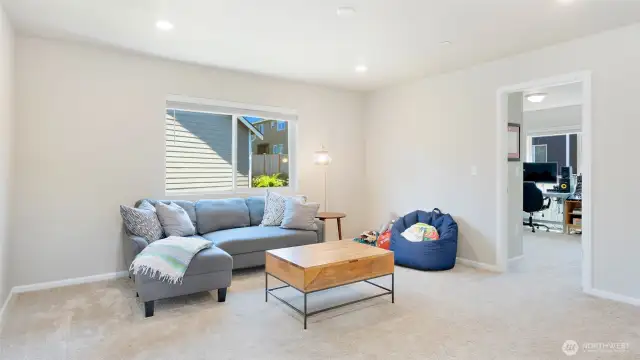 Upstairs, this loft is so spacious! Perfect for pause or play, reading a good book, or just for separation from the downstairs.