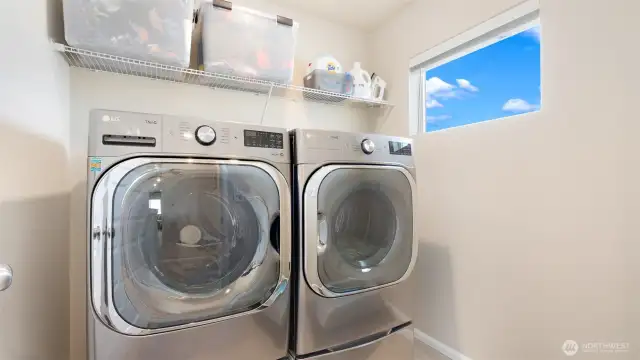 The laundry is upstairs, right where it should be... and yes the high window provides lots of natural light.