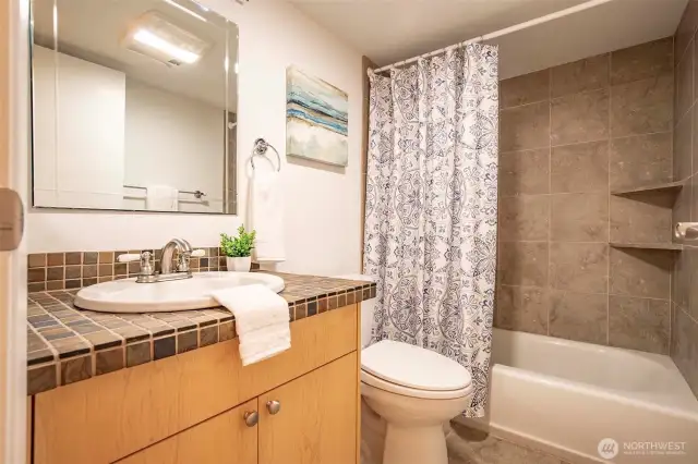 Updated Hall Bath with Limestone Tiling