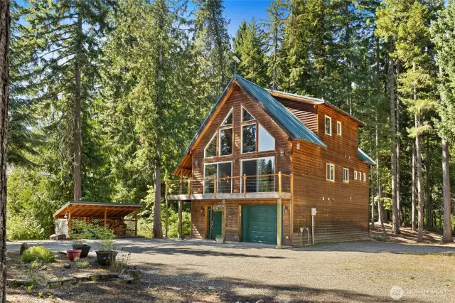 Level and fire-wise, this well-kept lot comes with a woodshed, perfect for storing firewood through the winter.