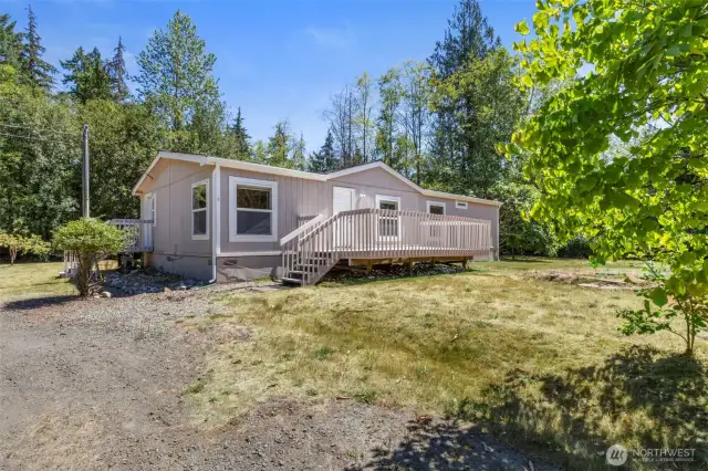 Home has nice deck area off front entry and features a brand new roof!