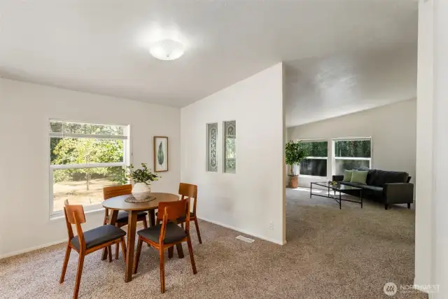 Dining area off living room with view to orchard.