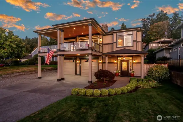 Timeless craftsmanship meets small-town charm in this inviting retreat with generous parking and lush landscaping.