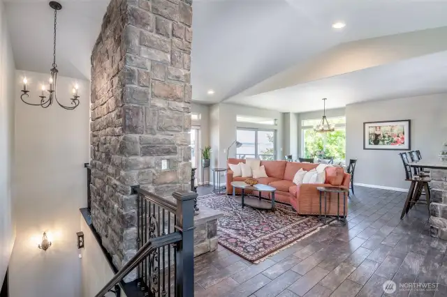 Vaulted ceilings and stonework converge in this airy great room designed for comfort and conversation.