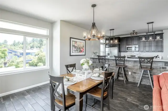 Crafted for entertaining, the open-concept kitchen and dining exude rustic charm and refined elegance.