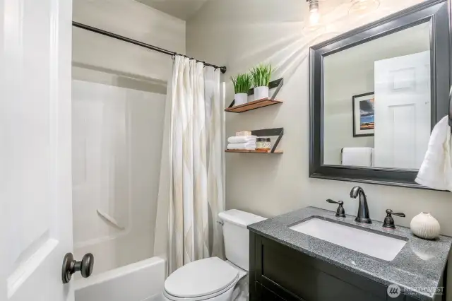 A stylish blend of comfort and function, with sleek finishes and charming open-shelf accents.