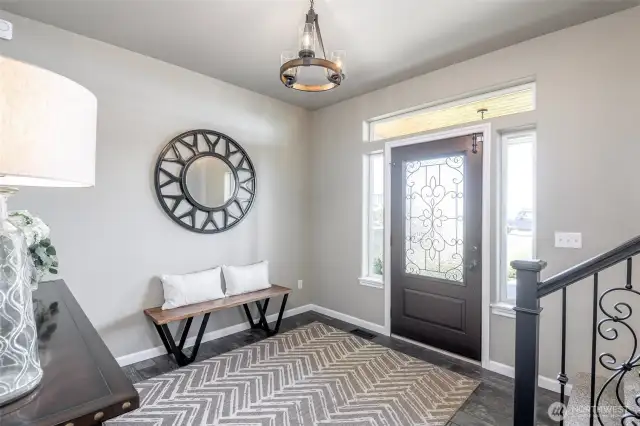 A warm and refined entryway sets the tone for coastal charm and timeless elegance.