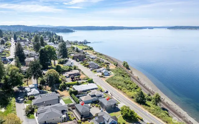 Unobstructed vistas meet historic charm in this serene coastal enclave along Puget Sound’s shimmering edge.