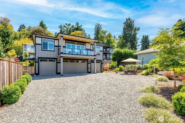 Elevated coastal living with expansive decks, manicured grounds, and a rare separate guest retreat.