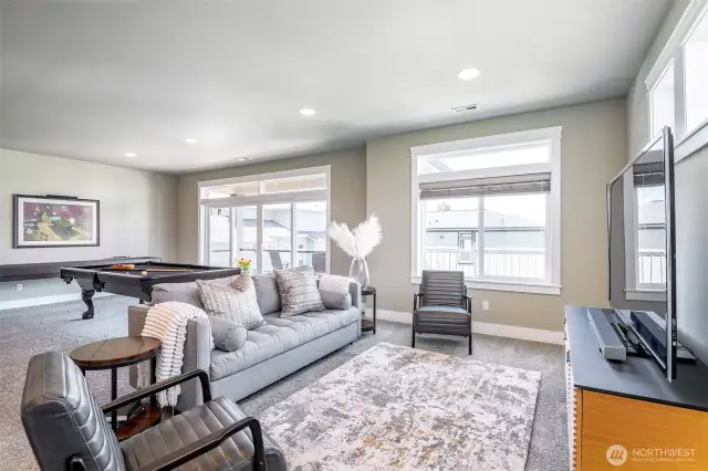 Light-filled ADU great room with deck access, sleek bar seating, and space to entertain or unwind.