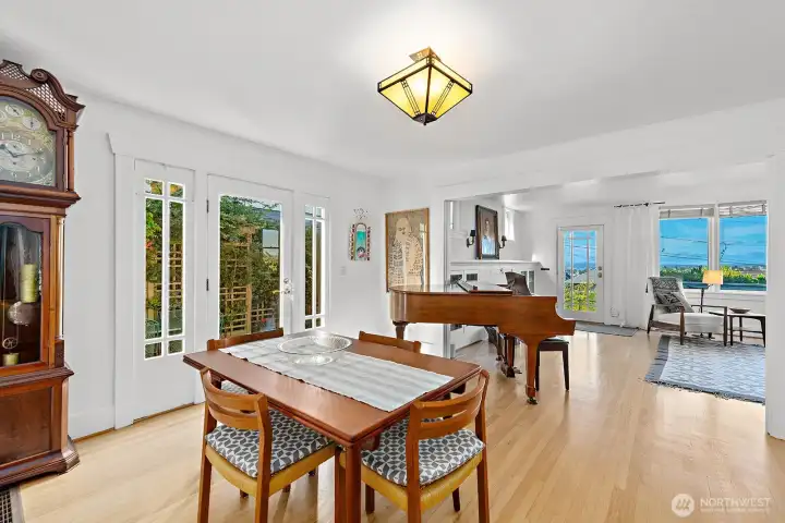 This photos shows the glass door in the dining room which opens to the side deck. This brings the BBQ (gas plumbed & included in the sale) to just steps from the dining room or kitchen door. It's like dining al fresco when the door is open.