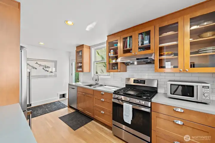 The glass cabinets offer plenty of room for dishware storage and the occasional art-glass bowl or serving platter to add a splash of color.