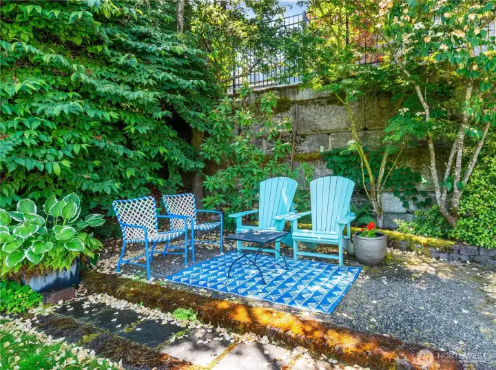 This is a very nice sitting area, keeping you cool even on a hot day. This is perfect as a conversation area and is situated at the back of the yard.