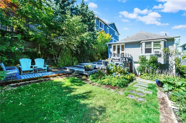 This angle shows the charm of the backyard and the wrap-around deck. This will be your in-city retreat for peace and tranquility after a long day.
