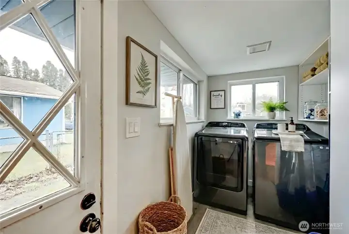 Laundry on main. Washer and dryer convey. Digitally staged.