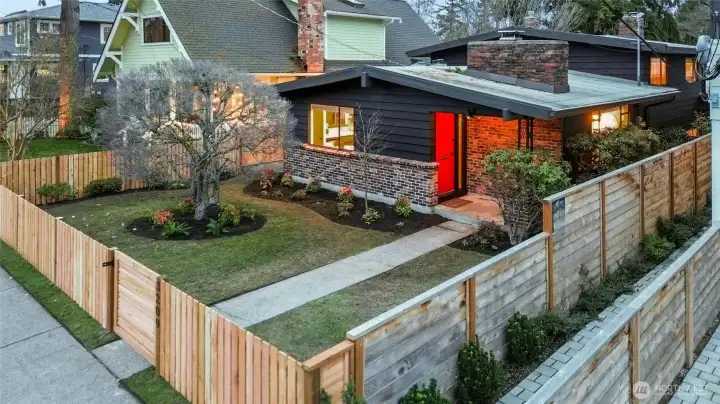 Mid century modern classic with new fence, secure gate and mature garden. Spring bulbs to come!
