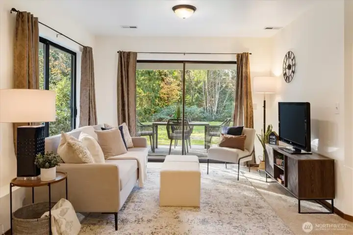 A comfortable Garden Level Family Room designed for casual living with sliding doors that extend the space onto the broad backyard lawn.