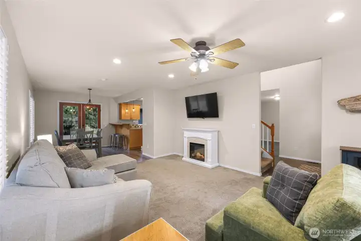 Living area flows into dining and kitchen