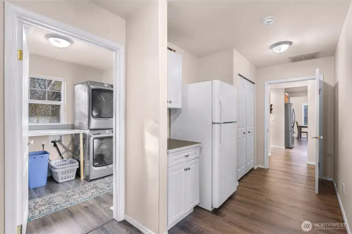 Large mud room with dedicated laundry room with sink and folding area