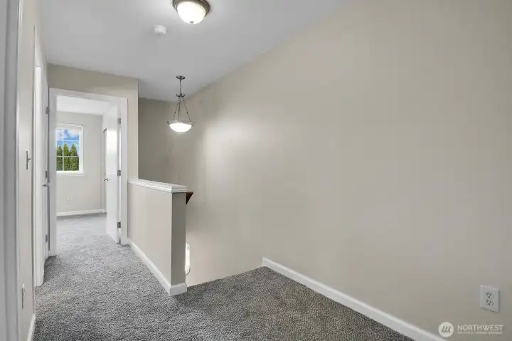 Second floor hallway with new carpets upstairs