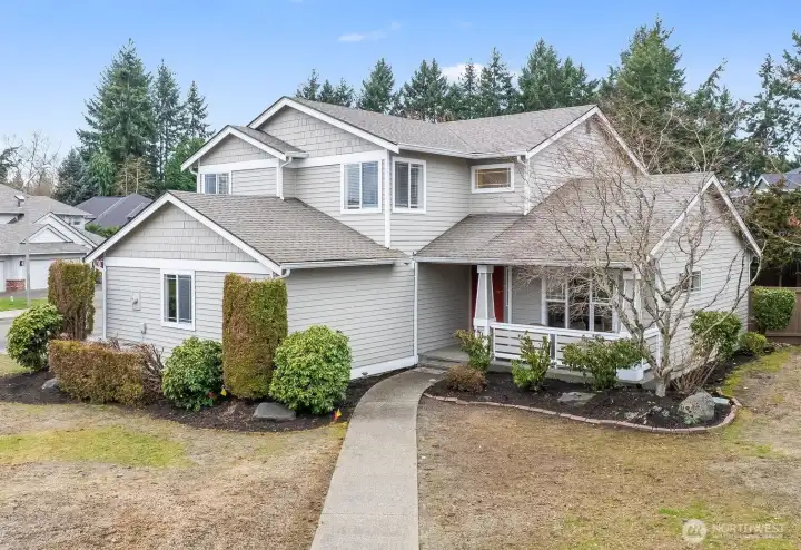 Beautiful corner lot home with attached garage in the back.